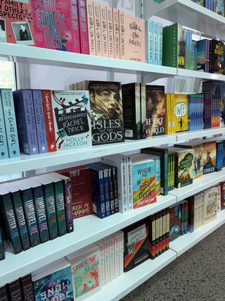 Shelf of fiction books in bookstore